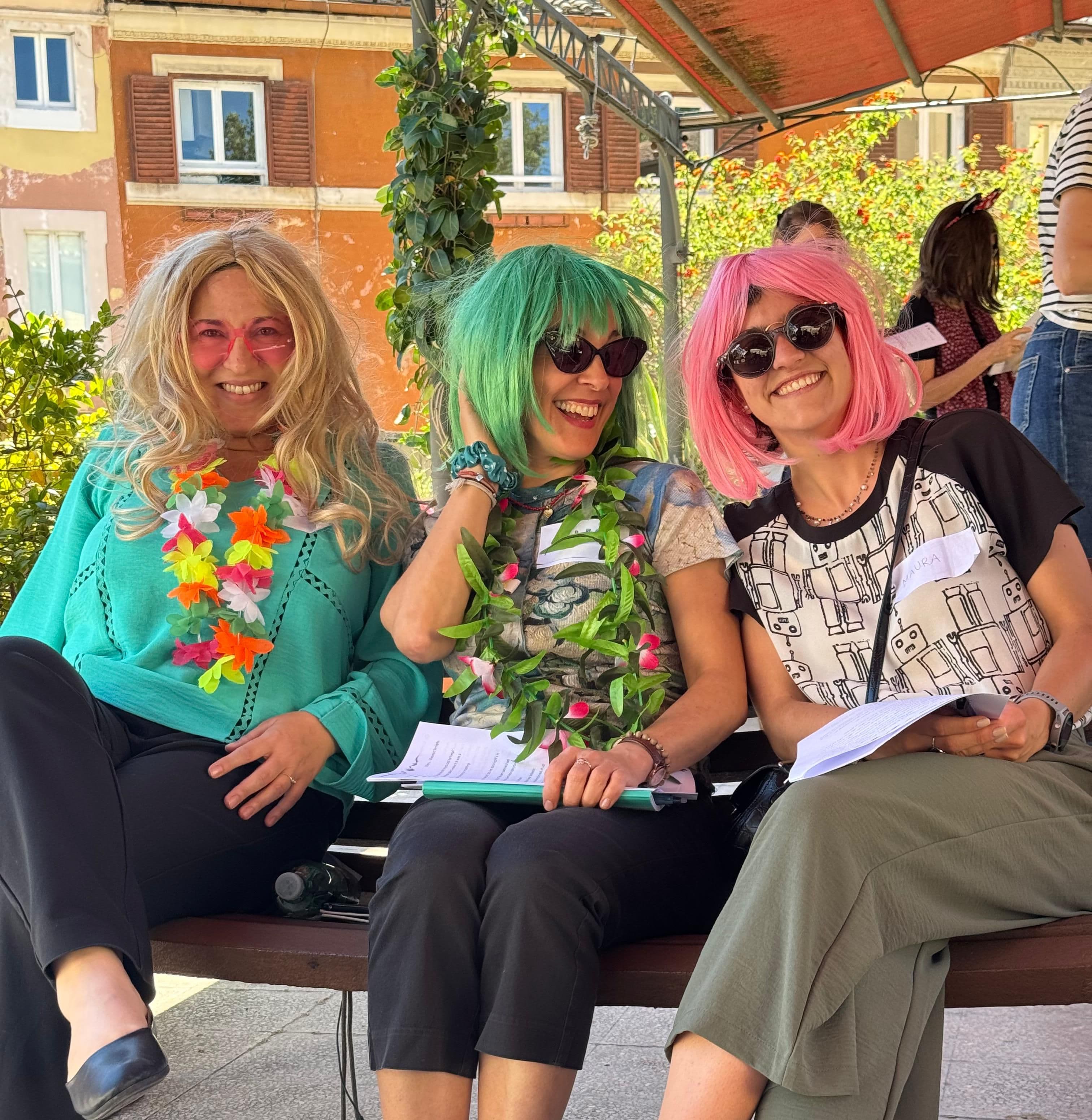 Drama and Pronunciation Workshop students wearing colourful wigs for the drama part